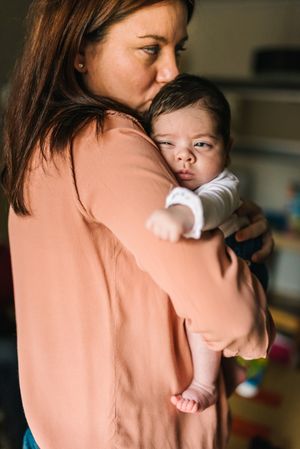 Mother holding baby in arms