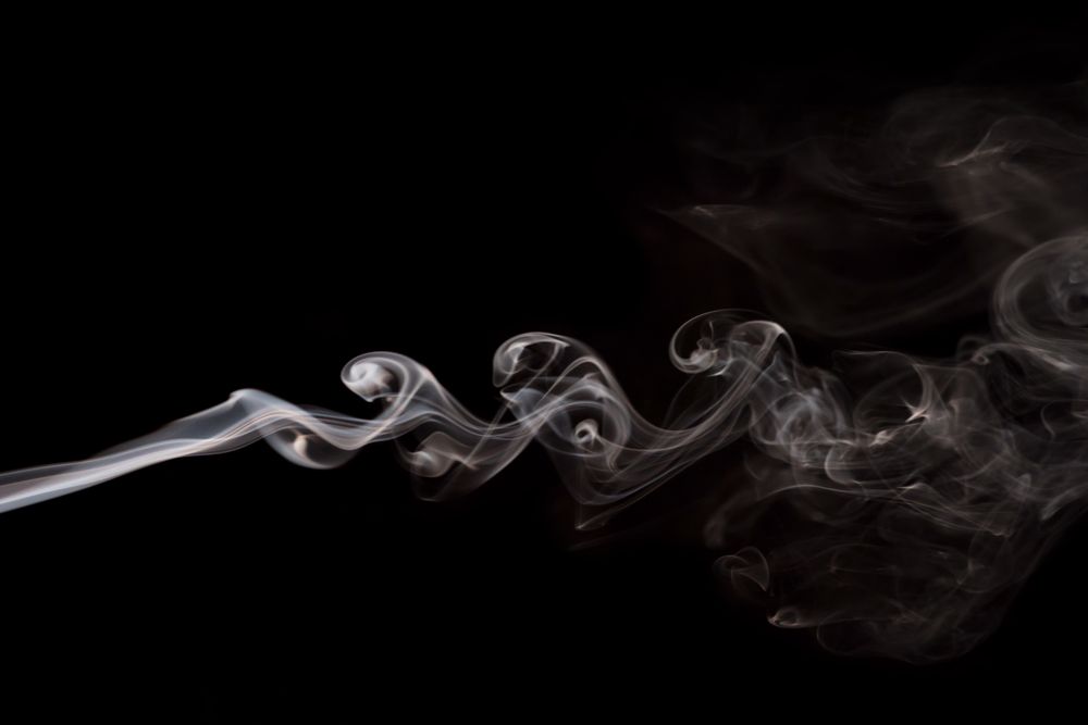 Abstract smoke moving on dark background