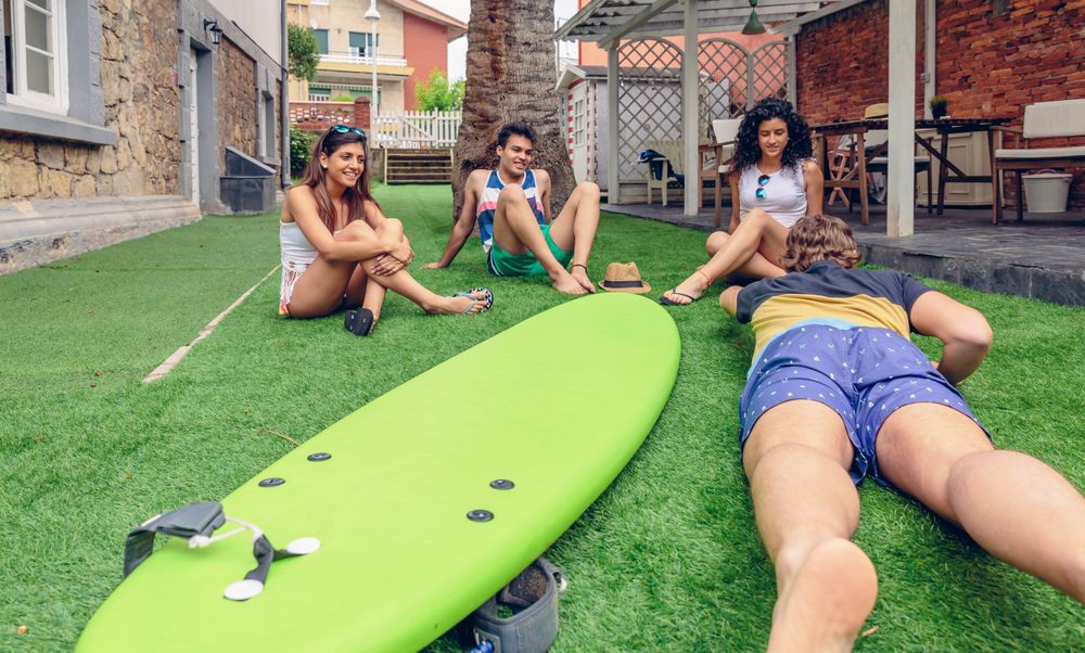 Group of people learning how to surf