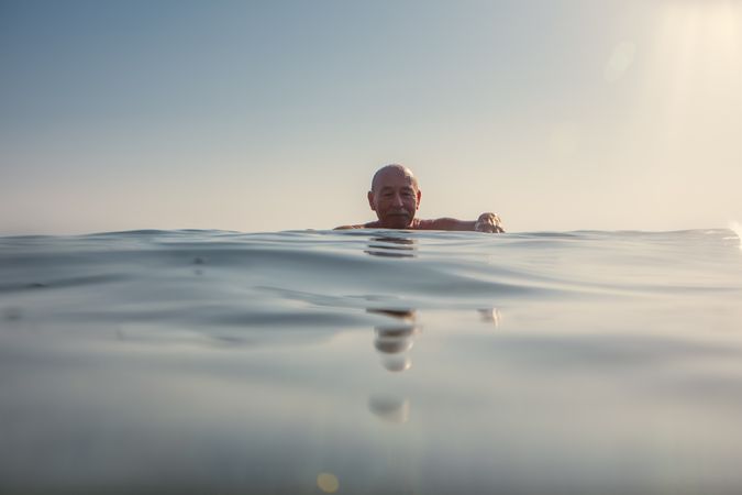 Man swimming under water in sea