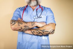 Cropped image of tattooed healthcare worker with stethoscope on neck 0gqP74