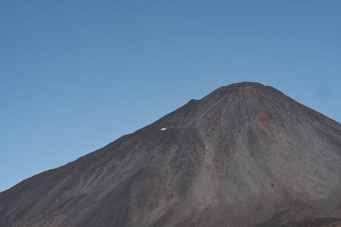 Mountain peak abutting sky in desert valley