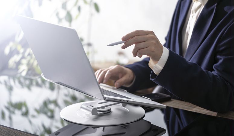 Businessman Working on Laptop at Office Desk