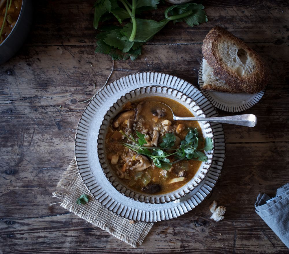 Bread and parsley near quinoa soup