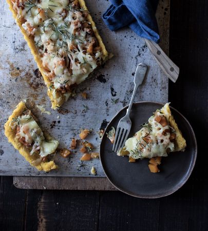 Delicious cake on tray near plate