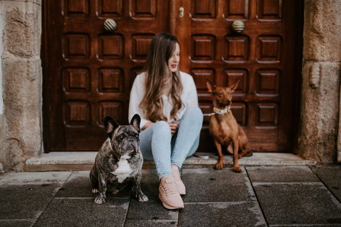 Woman with dogs on street