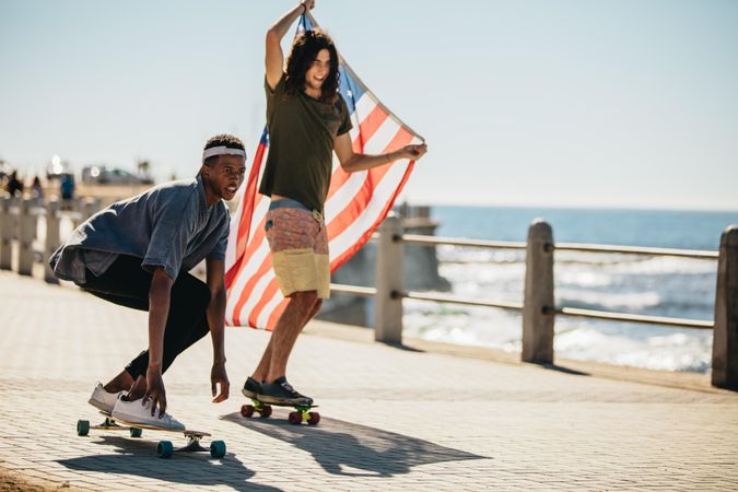 Two young skateboarders with USA flag