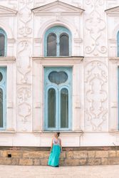 Woman leaving ornamental building