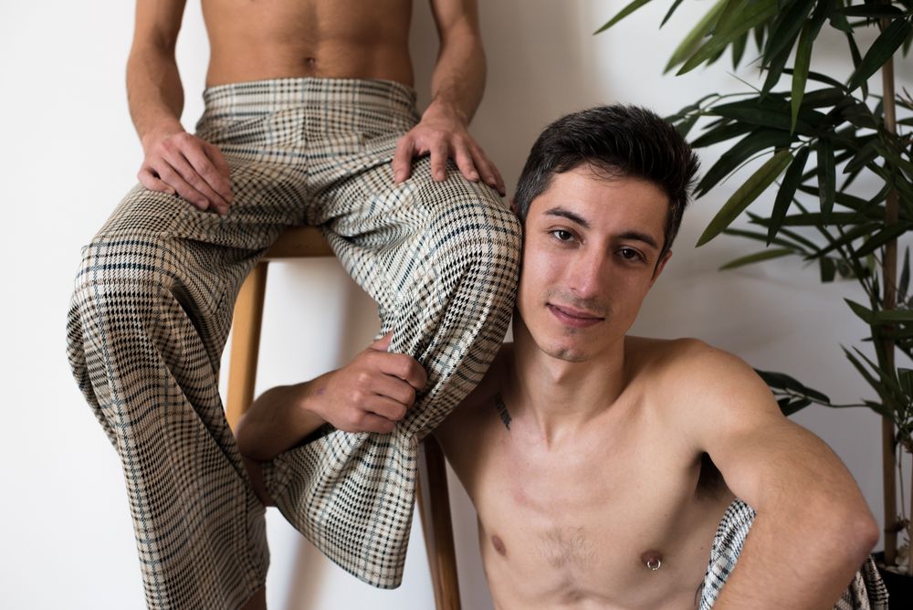 Stylish shirtless gay couple posing