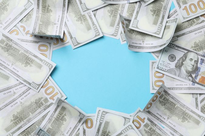 Dollar money on blue background, space for text