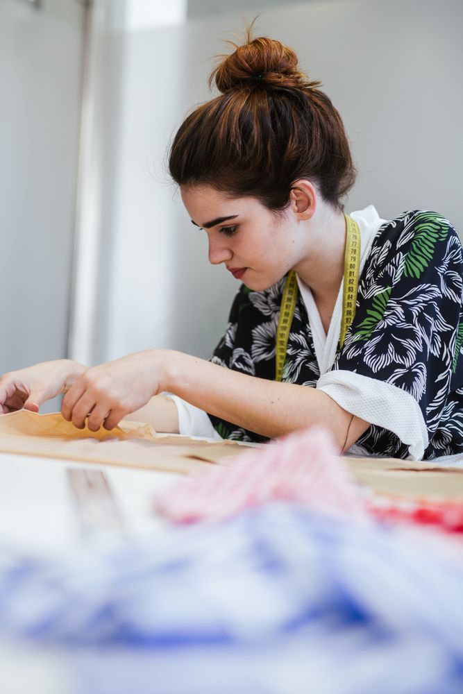 Woman in a sewing school