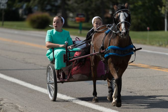 Amish girls ride through Winesburg, Ohio
