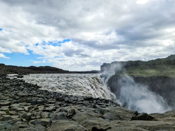 Majestic icelandic waterfall cascading over rocks