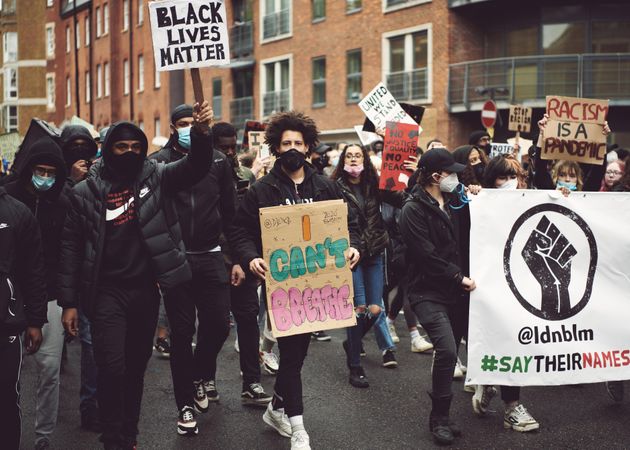London, England, United Kingdom - June 6th, 2020: Group of young adults marching at BLM protest