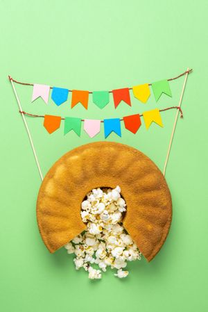 Overhead of cornmeal cake with popcorn
