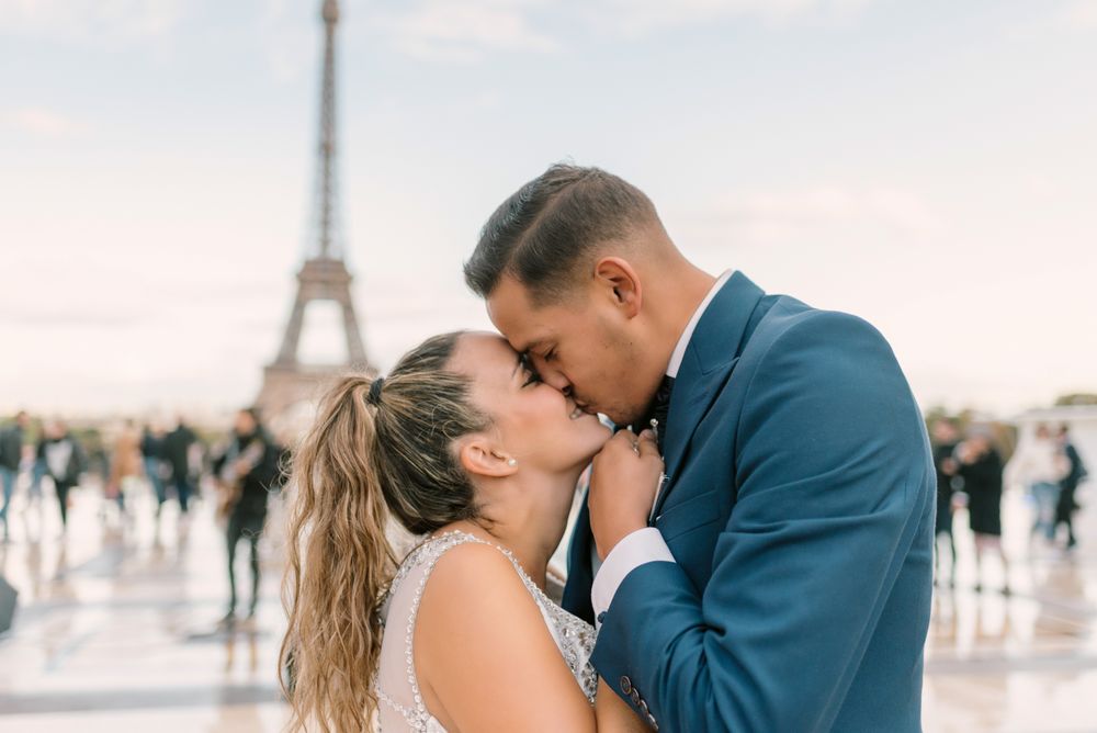 Happy newlyweds in wedding clothing kissing