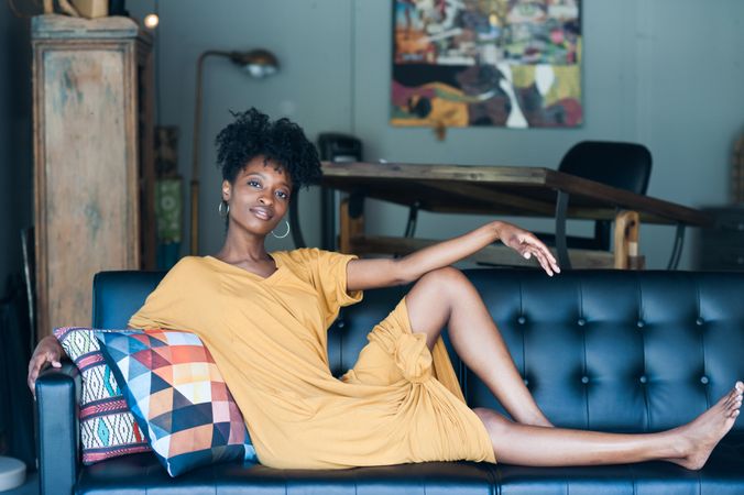 Woman on black couch