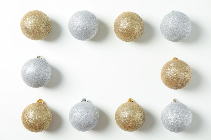 Flat lay with christmas balls on plain background, space for text