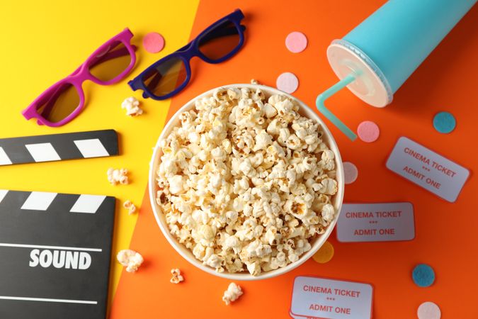 Flat lay. Movie watch accessories on two tone background, top view
