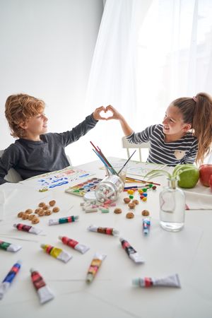 Positive children showing heart gesture