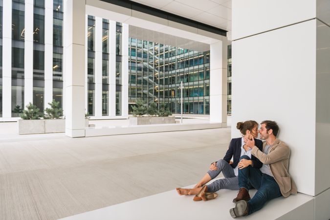 Businesspeople resting outside modern building