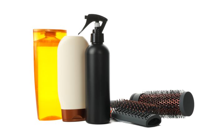 Different hairdresser accessories isolated on plain background