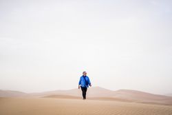Mature man walking in desert