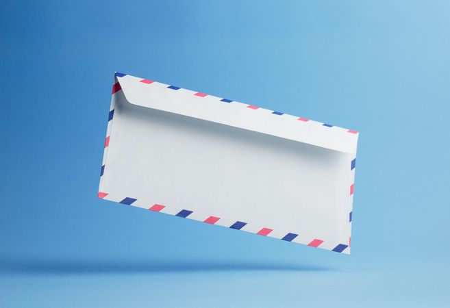 Diagonal floating envelope over light blue background