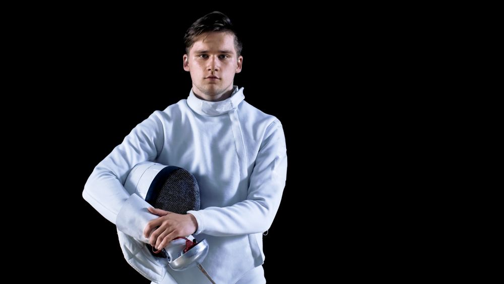 Portrait Shot of a Young Fencer Standing and Looking into Camera.