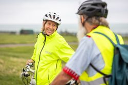 Two cyclists stopped for a quick talk