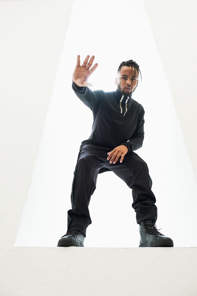 Dancing Black male with braids