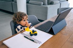 Little boy watching video on tablet