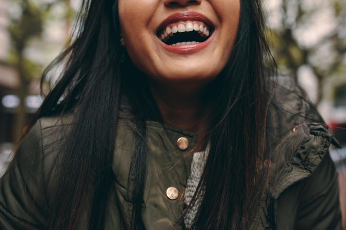 Closeup of woman smiling and wearing jacket