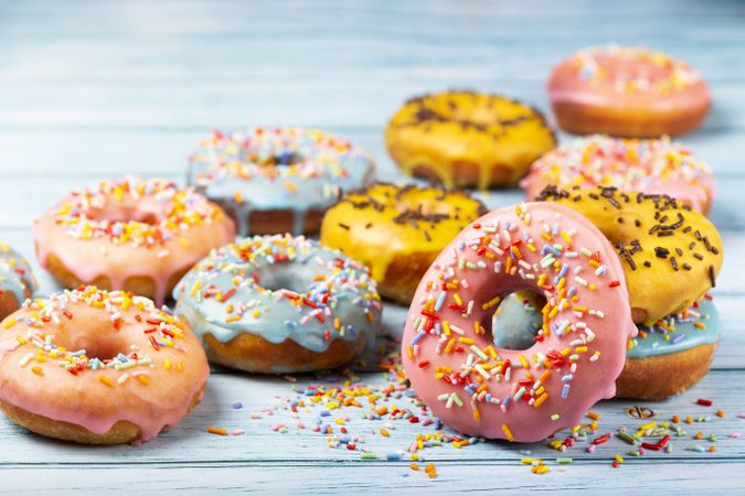 Delicious assorted colorful donuts on the table.