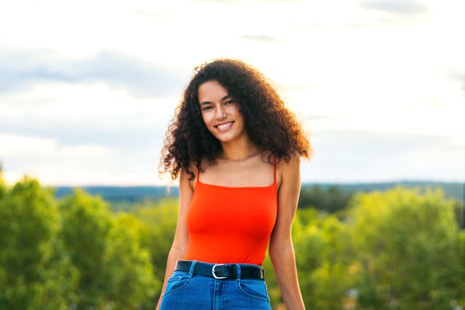 woman with curly hair portrait on a terrace