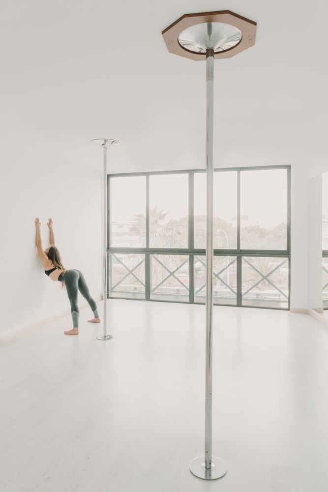Flexible female stretching in studio