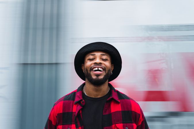 Happy man on blurred street