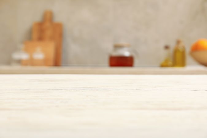 wooden table on blurred kitchen interior background