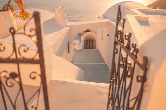Magic hour shot of stairs in Santorini leading down to the sea