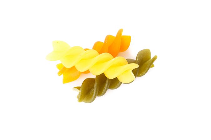 Pasta isolated on light background, closeup. Dry raw whole pasta