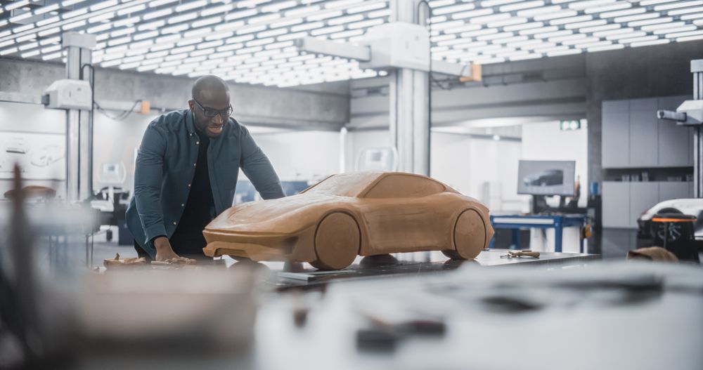 Black Modeler Working in a Research and Development Studio at a Vehicle Production Factory