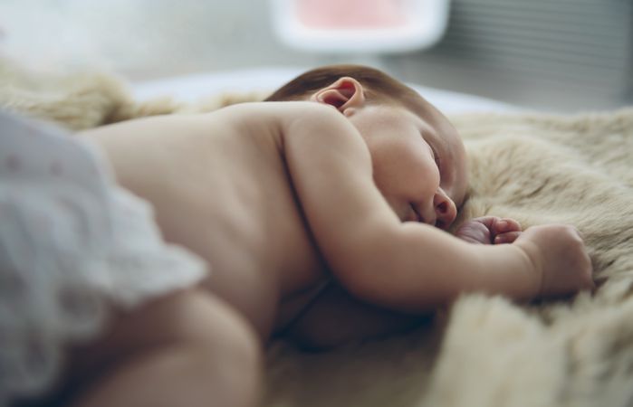 Baby sleeping on a blanket