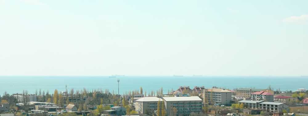 Resort town panorama against blue sea. Amazing spring weather