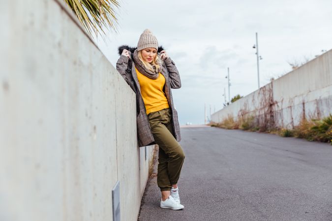 Portrait of blonde woman posing in the city