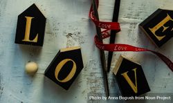 Love spelled in blocks on table 5aXX8v