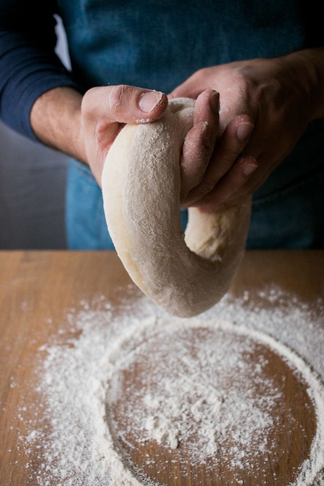 Crop man preparing Rosca de Reyes