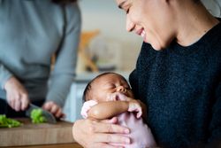 Close up of mother and baby in kitchen