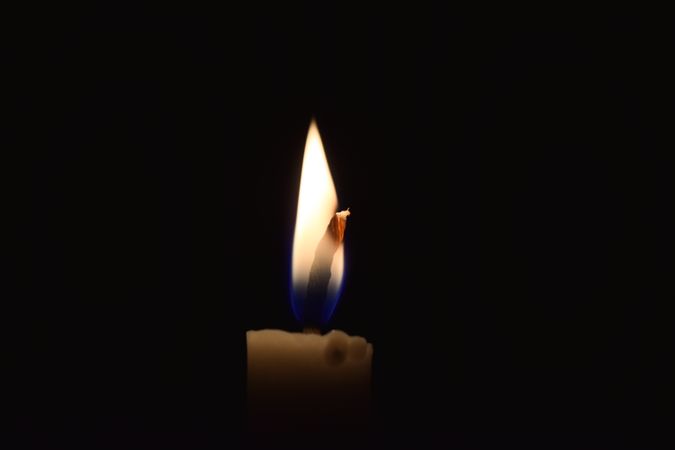 Candle lit in the dark