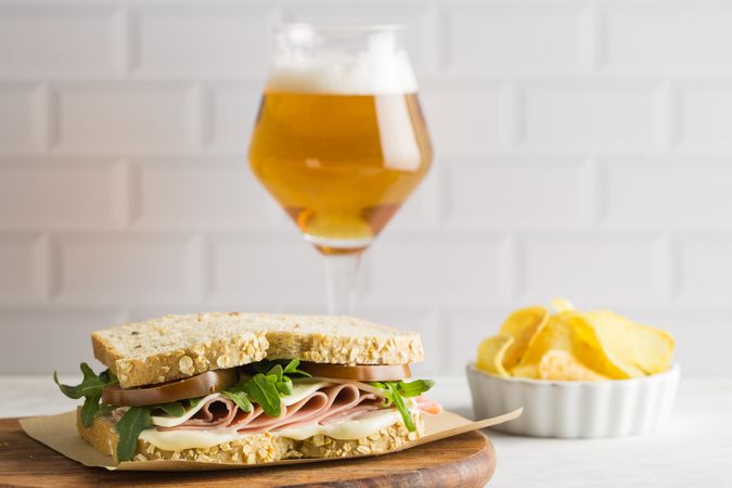 Delicious sandwich with ham, cheese, lettuce and tomato