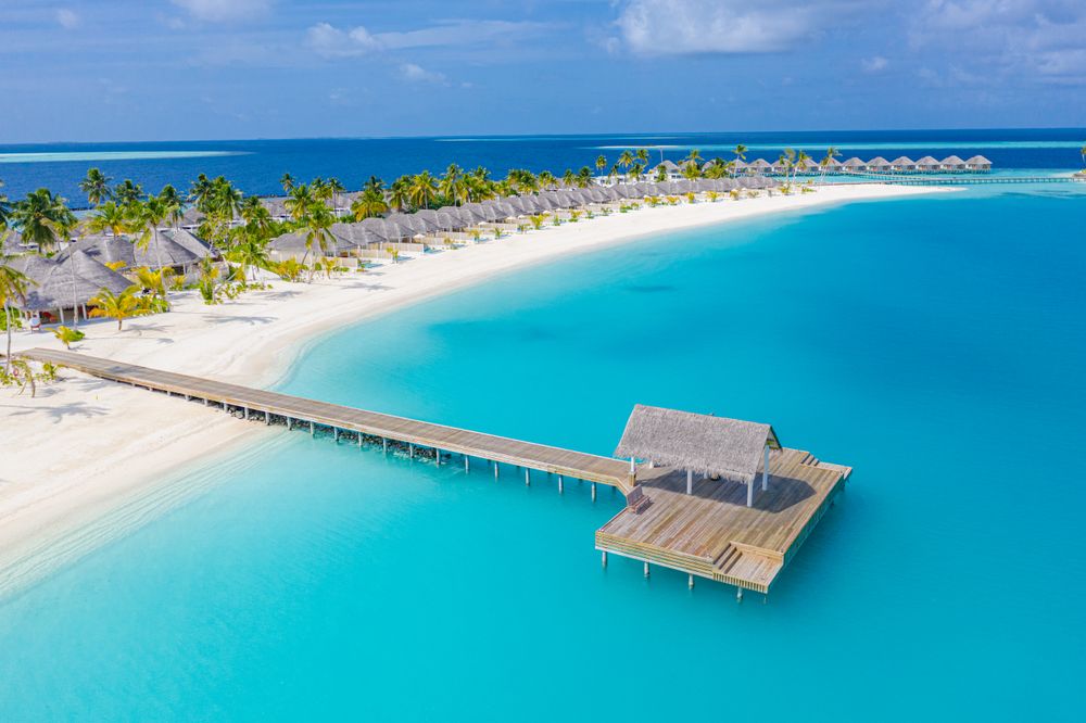 Idyllic pier on a beach resort in the Maldives, landscape